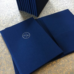 Invitation Pocket Folders Covered in Navy with Matte Gold Foil Stamping